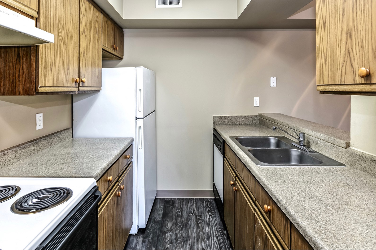 Spacious kitchen with pass-through breakfast bar at Fox Valley Apartments in Omaha, NE